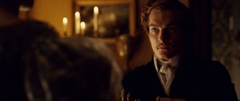 Movie still from “The Young Victoria” (2009), directed by Jean-Marc Vallée – A man in a suit and tie looking at the camera; Close Up shot, Over the shoulder angle