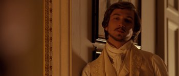 Movie still from “The Young Victoria” (2009), directed by Jean-Marc Vallée – A man in a white suit standing in front of a window; Close Up shot, Over the shoulder angle