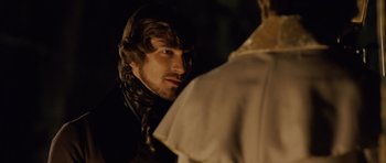 Movie still from “The Young Victoria” (2009), directed by Jean-Marc Vallée – A young man looking into a mirror while standing in front of a mirror; Close Up shot, Over the shoulder angle