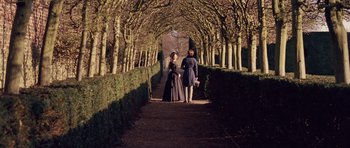 Movie still from “The Young Victoria” (2009), directed by Jean-Marc Vallée – A man and a woman are walking down a path; Wide shot, High angle