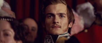 Movie still from “The Young Victoria” (2009), directed by Jean-Marc Vallée – A person with a mustache wearing a uniform; Close Up shot, Over the shoulder angle
