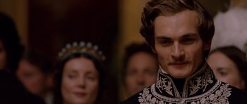 Movie still from “The Young Victoria” (2009), directed by Jean-Marc Vallée – A person wearing a crown; Close Up shot, Over the shoulder angle