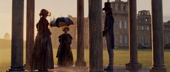 Movie still from “The Young Victoria” (2009), directed by Jean-Marc Vallée – A man and a woman standing under an umbrella in the rain; Wide shot, Low angle