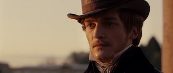 Movie still from “The Young Victoria” (2009), directed by Jean-Marc Vallée – A person wearing a hat; Close Up shot, Over the shoulder angle