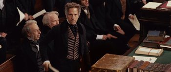 Movie still from “The Young Victoria” (2009), directed by Jean-Marc Vallée – A man standing next to a wooden box; Medium shot, Over the shoulder angle