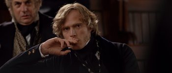Movie still from “The Young Victoria” (2009), directed by Jean-Marc Vallée – A person smoking a cigarette; Close Up shot, Over the shoulder angle