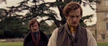 Movie still from “The Young Victoria” (2009), directed by Jean-Marc Vallée – Two men in period clothing standing next to each other; Medium shot, Over the shoulder angle