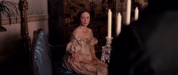 Movie still from “The Young Victoria” (2009), directed by Jean-Marc Vallée – A woman sitting on the floor in a room; Medium shot, Over the shoulder angle
