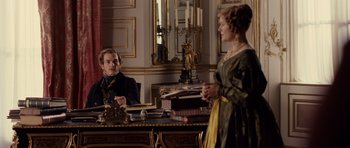 Movie still from “The Young Victoria” (2009), directed by Jean-Marc Vallée – A man and a woman sitting at a table; Medium shot, Over the shoulder angle