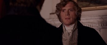 Movie still from “The Young Victoria” (2009), directed by Jean-Marc Vallée – A person wearing a suit and tie; Close Up shot, Over the shoulder angle