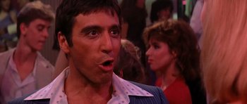 Movie still from “Scarface” (1983), directed by Brian De Palma – A person with his mouth wide open; Close Up shot, Low angle