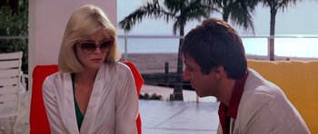 Movie still from “Scarface” (1983), directed by Brian De Palma – A man and a woman talking to each other; Medium shot, Over the shoulder angle