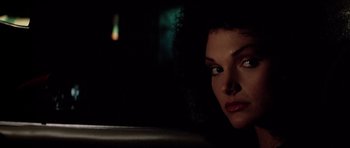 Movie still from “Scarface” (1983), directed by Brian De Palma – A person looking at the camera; Close Up shot, Low angle