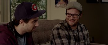 Movie still from “This Is the End” (2013), directed by Seth Rogen – Two men sitting on a couch talking to each other; Close Up shot, Over the shoulder angle