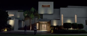 Movie still from “This Is the End” (2013), directed by Seth Rogen – Two people standing outside of a house at night; Extreme Wide shot, Low angle