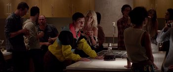 Movie still from “This Is the End” (2013), directed by Seth Rogen – A man and a woman sitting at a table in a kitchen; Medium shot, Over the shoulder angle