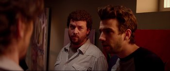 Movie still from “This Is the End” (2013), directed by Seth Rogen – Two men standing next to each other in front of a mirror; Close Up shot, Over the shoulder angle