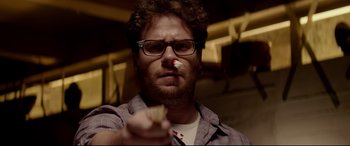 Movie still from “This Is the End” (2013), directed by Seth Rogen – A man holding a piece of paper in his hand; Close Up shot, Over the shoulder angle