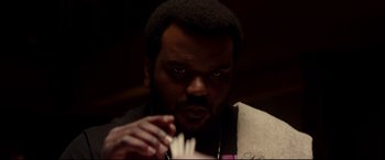 Movie still from “This Is the End” (2013), directed by Seth Rogen – A person holding something in his hand; Close Up shot, Low angle