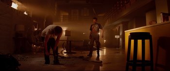 Movie still from “This Is the End” (2013), directed by Seth Rogen – Two men are working in an abandoned building; Wide shot, Low angle