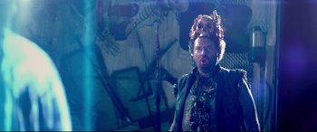 Movie still from “This Is the End” (2013), directed by Seth Rogen – A man with a beard wearing a crown and a necklace; Medium shot, Low angle