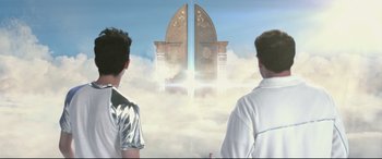 Movie still from “This Is the End” (2013), directed by Seth Rogen – Two men standing in front of an open door in the sky; Medium shot, Low angle