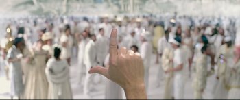 Movie still from “This Is the End” (2013), directed by Seth Rogen – A hand with a middle finger pointing to a crowd of people; Extreme Close Up shot, Overhead angle