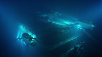 Movie still from “Titanic” (1997), directed by James Cameron – An underwater view of an airplane in the ocean; Extreme Wide shot, High angle