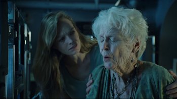 Movie still from “Titanic” (1997), directed by James Cameron – An older woman and a younger woman looking at each other; Close Up shot, Over the shoulder angle