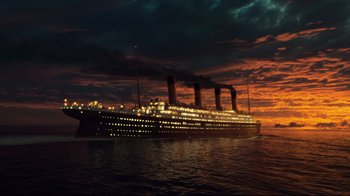 Movie still from “Titanic” (1997), directed by James Cameron – A large cruise ship in the ocean at night; Extreme Wide shot, Low angle