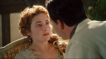 Movie still from “Titanic” (1997), directed by James Cameron – A man and a woman looking at one another; Close Up shot, Over the shoulder angle