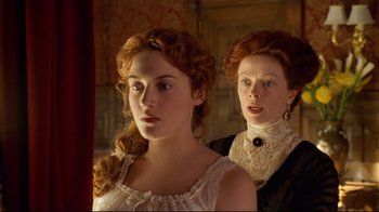 Movie still from “Titanic” (1997), directed by James Cameron – A woman and a woman standing next to each other in front of a mirror; Close Up shot, Low angle
