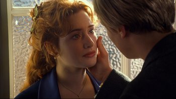 Movie still from “Titanic” (1997), directed by James Cameron – A young woman looking at a young man's face; Close Up shot, Over the shoulder angle