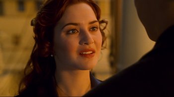 Movie still from “Titanic” (1997), directed by James Cameron – A person wearing a jacket; Close Up shot, Over the shoulder angle