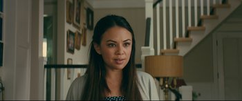Movie still from “To All the Boys I've Loved Before” (2018), directed by Susan Johnson – A woman with long black hair wearing a black and white polka dot shirt; Close Up shot, Over the shoulder angle