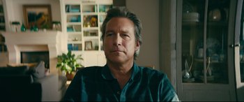 Movie still from “To All the Boys I've Loved Before” (2018), directed by Susan Johnson – A person sitting in a chair; Close Up shot, Low angle