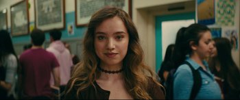 Movie still from “To All the Boys I've Loved Before” (2018), directed by Susan Johnson – A young woman with long hair and a brown shirt; Close Up shot, Over the shoulder angle