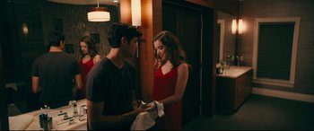 Movie still from “To All the Boys I've Loved Before” (2018), directed by Susan Johnson – A man and a woman standing next to each other; Medium shot, Over the shoulder angle