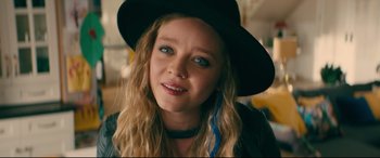 Movie still from “To All the Boys I've Loved Before” (2018), directed by Susan Johnson – A person wearing a hat; Close Up shot, Over the shoulder angle