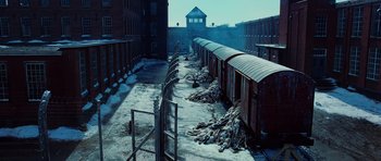 Movie still from “Shutter Island” (2010), directed by Martin Scorsese – A view of a train yard in the snow; Extreme Wide shot, High angle