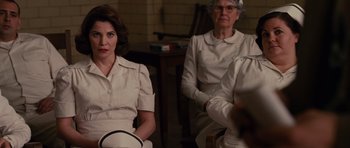 Movie still from “Shutter Island” (2010), directed by Martin Scorsese – A group of people sitting in a room; Medium shot, Over the shoulder angle