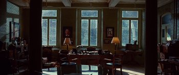 Movie still from “Shutter Island” (2010), directed by Martin Scorsese – A room filled with furniture and a large window; Wide shot, High angle