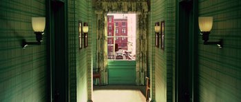 Movie still from “Shutter Island” (2010), directed by Martin Scorsese – A green room with a view of a building; Extreme Wide shot, High angle