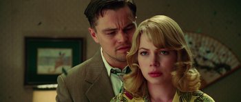 Movie still from “Shutter Island” (2010), directed by Martin Scorsese – A man and a woman standing next to each other in a room; Close Up shot, Over the shoulder angle