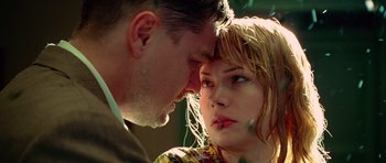 Movie still from “Shutter Island” (2010), directed by Martin Scorsese – A man and a woman face to face in a forest; Close Up shot, Low angle