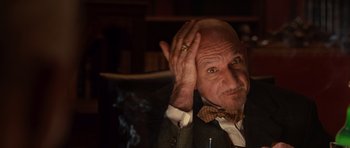 Movie still from “Shutter Island” (2010), directed by Martin Scorsese – An older man with a ring on his finger; Close Up shot, Low angle