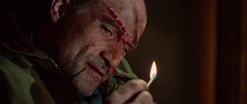 Movie still from “Shutter Island” (2010), directed by Martin Scorsese – A person holding a lit candle; Close Up shot, Low angle