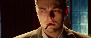 Movie still from “Shutter Island” (2010), directed by Martin Scorsese – A person with a cigarette in his mouth; Close Up shot, Low angle