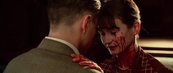 Movie still from “Shutter Island” (2010), directed by Martin Scorsese – A man and a woman with blood all over their face; Close Up shot, High angle