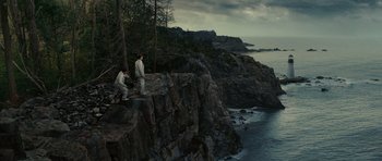 Movie still from “Shutter Island” (2010), directed by Martin Scorsese – Two men standing on a cliff overlooking the ocean; Extreme Wide shot, High angle
